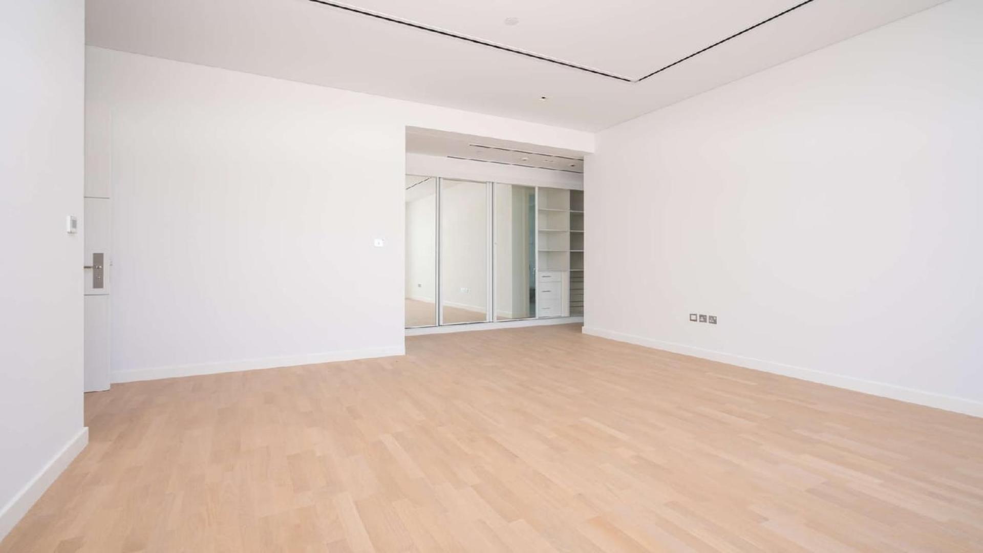 Modern kitchen in luxurious 2-bedroom apartment, Seventh Heaven, Al Barari, with sleek white design