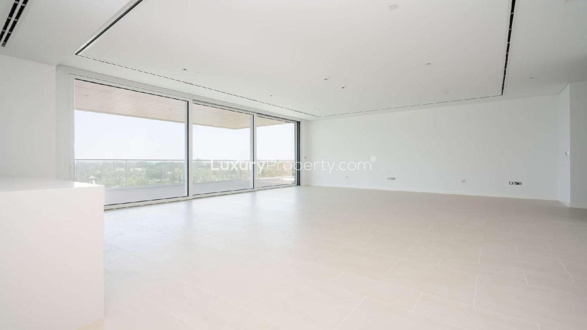 Modern open-plan living area in Seventh Heaven, Al Barari apartment with large windows
