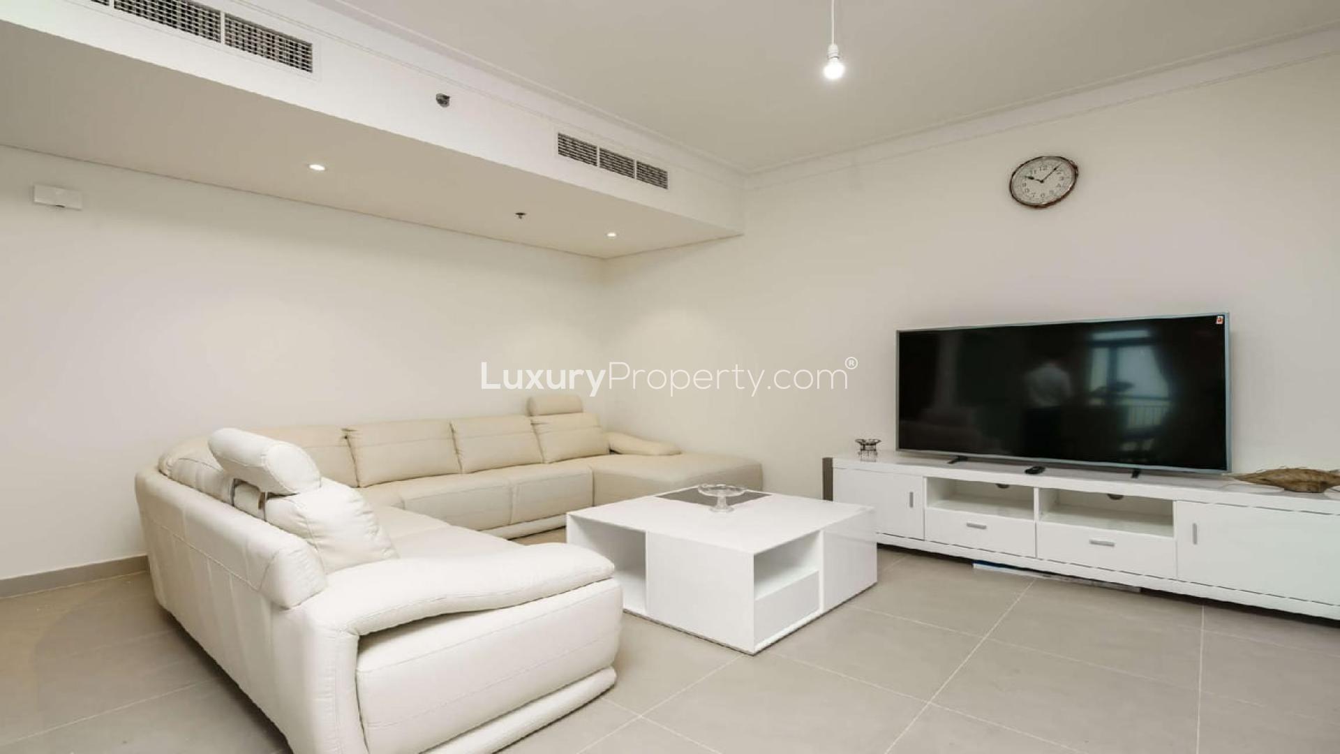 Modern living room and kitchen in furnished 2-bedroom apartment, Dubai Creek Harbour