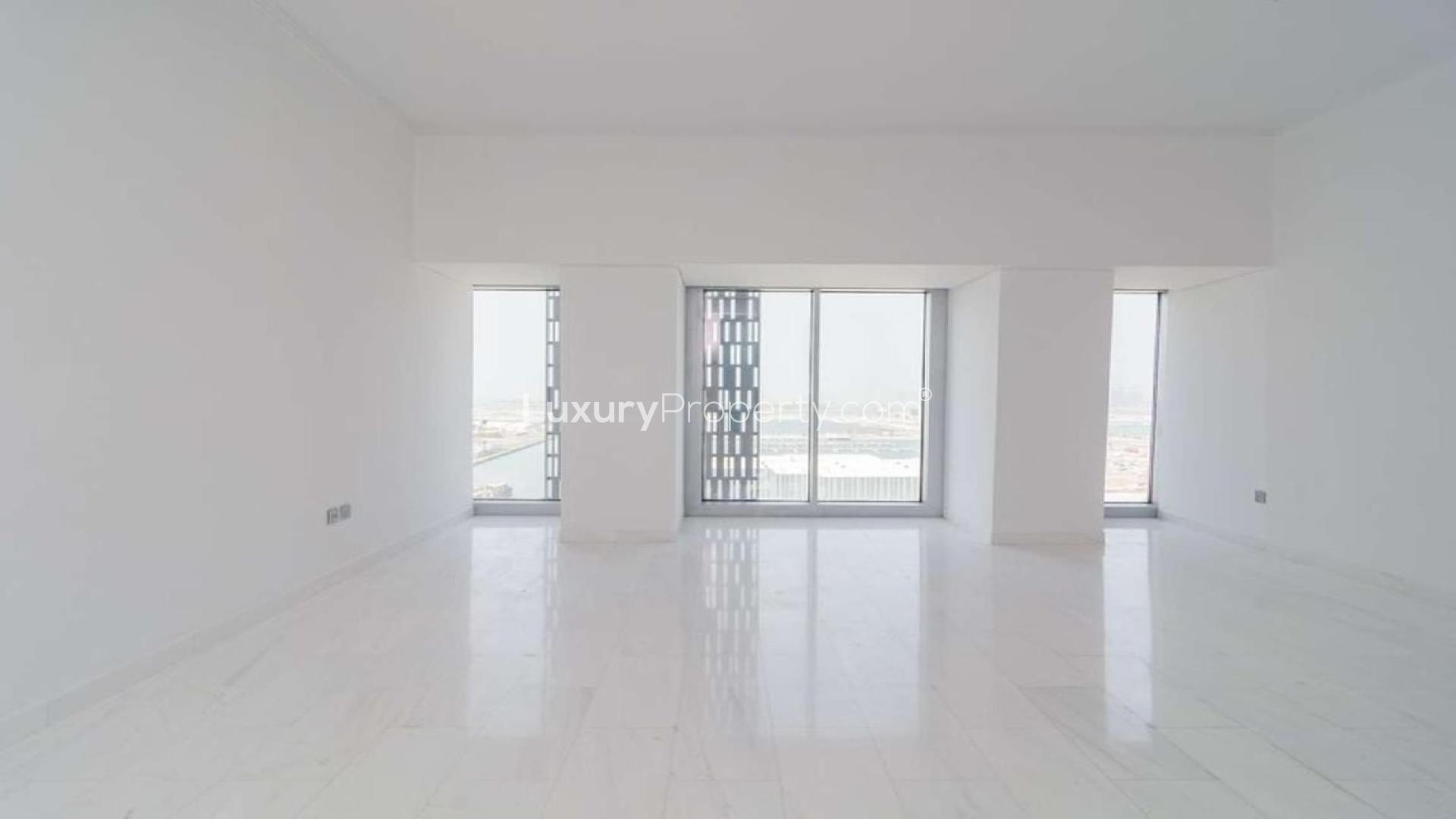High-floor Dubai Marina apartment interior with large windows and partial sea view
