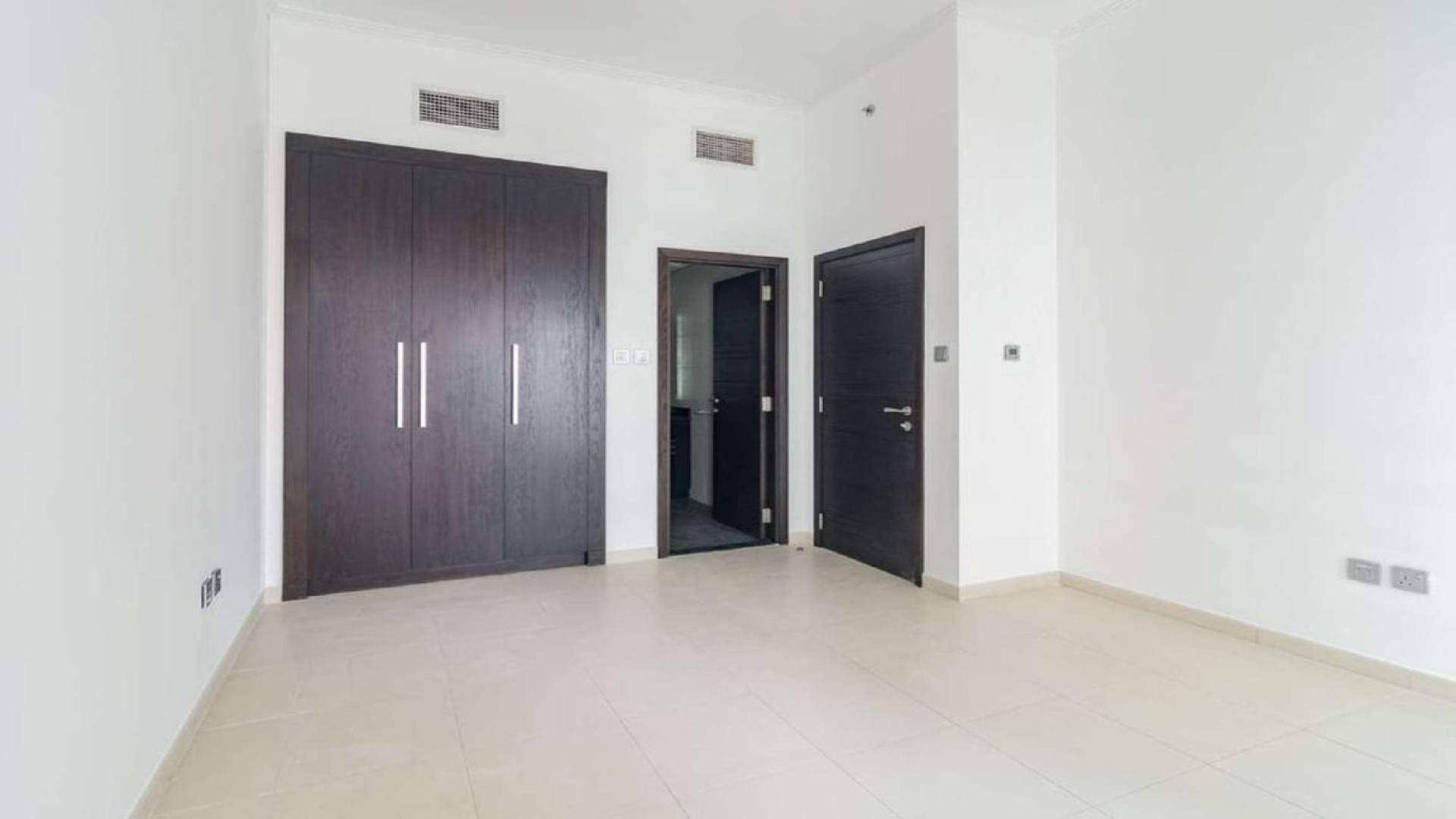 High-floor apartment view, Dubai Marina skyline and partial sea, Cayan Tower rental