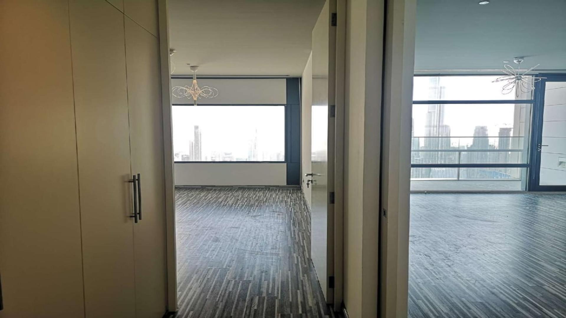 High-floor DIFC apartment with full Burj Khalifa view, two bedrooms, three bathrooms for rent