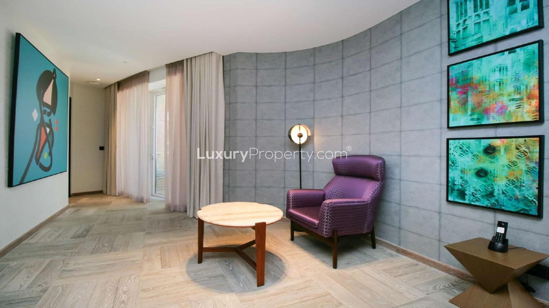 Modern living room and kitchen in two-bed serviced apartment, Andaz Dubai The Palm