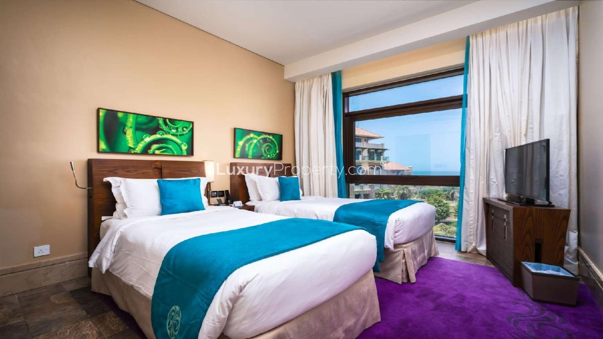 "Luxury bedroom in Sofitel Palm apartment, Palm Jumeirah, with twin beds and sea view.",N/A,Luxurious bathroom view in Sofitel The Palm, Palm Jumeirah serviced residence apartment
