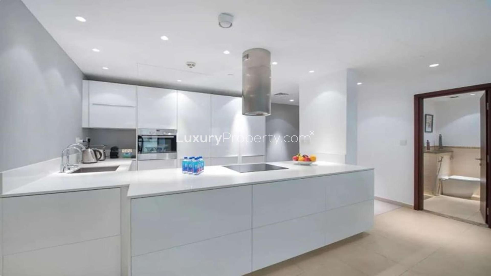 Modern kitchen in 2-bedroom apartment, Amwaj 4, JBR, with sleek white cabinets and appliances