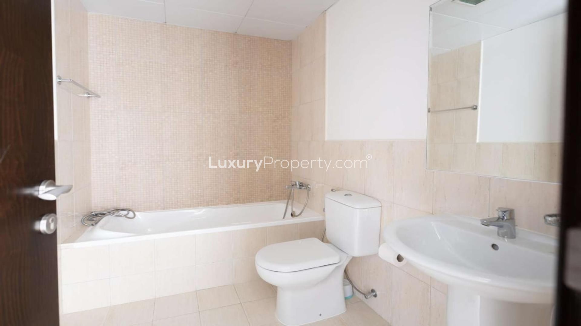 Modern kitchen in spacious 2-bedroom apartment for rent, JVC, with dark wood cabinets