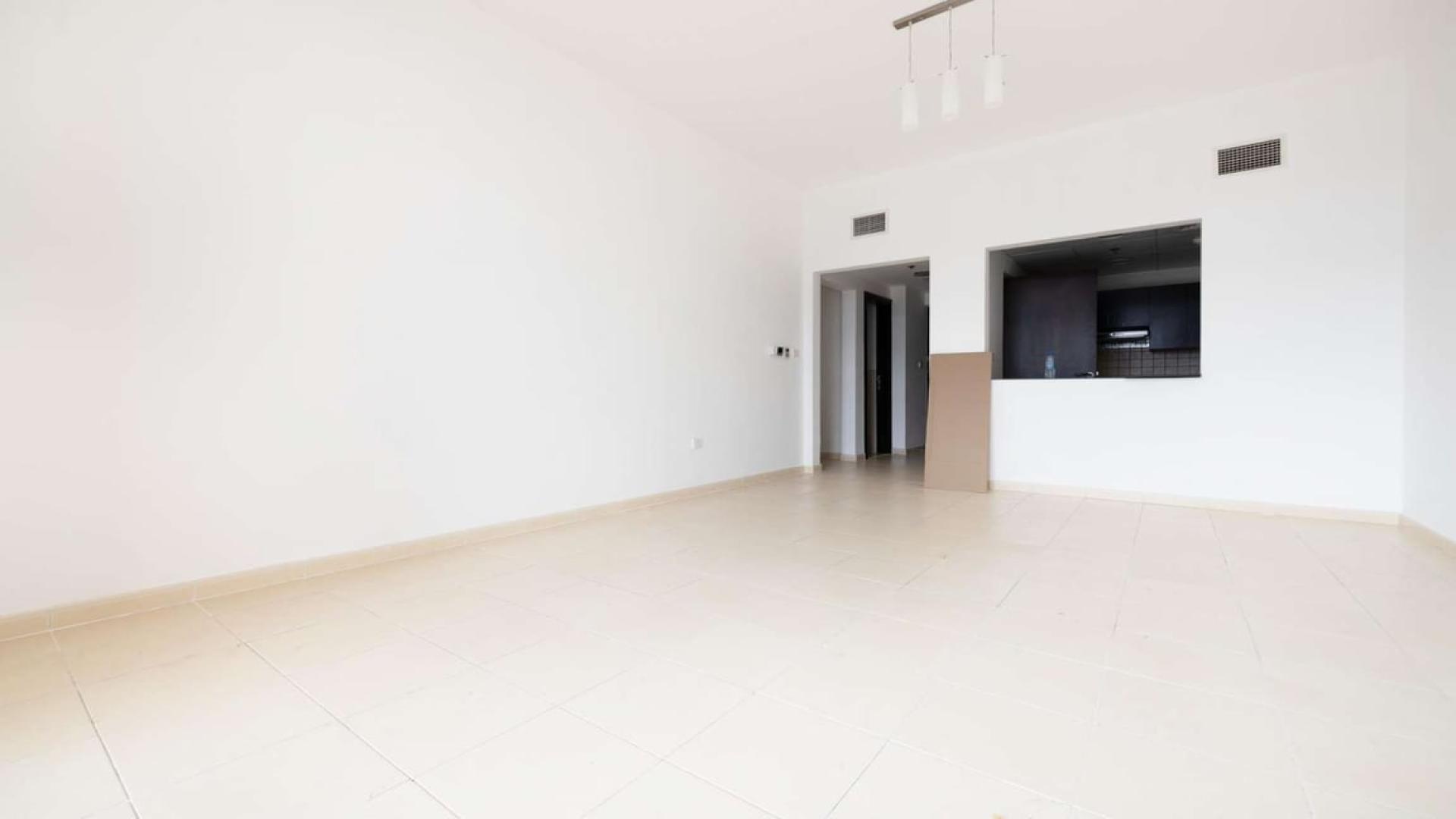 Ground floor apartment living area with large windows, Summer JVC, for rent