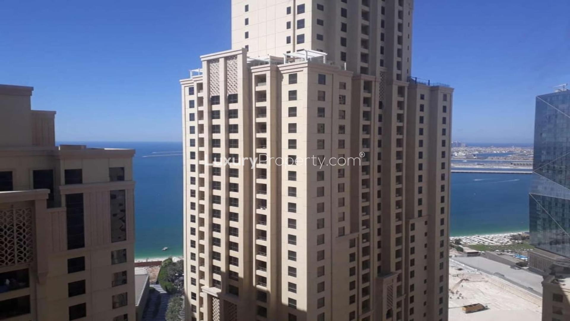 "Jumeirah Beach Residence apartment with ocean views, available for rent in Bahar community.",Bathroom in luxury Jumeirah Beach Residence apartment, featuring modern sink and toilet