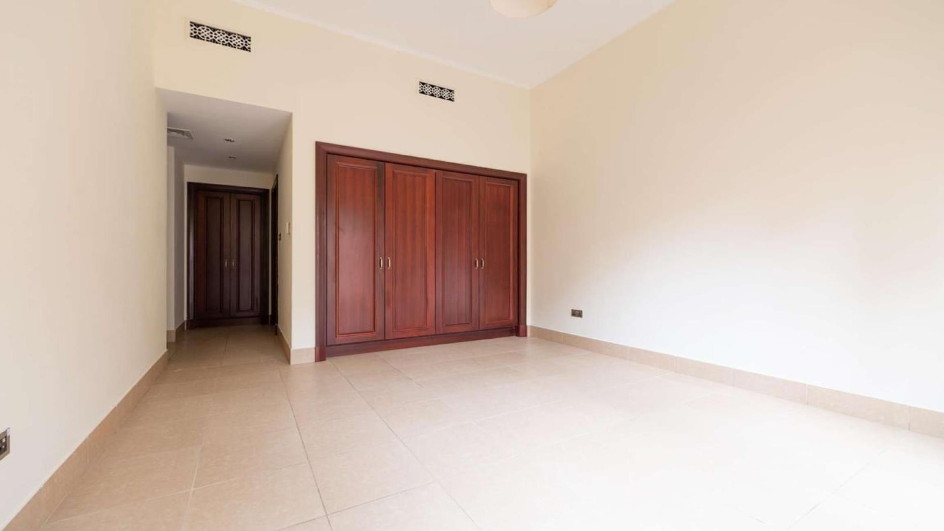 Luxurious kitchen with wooden cabinets in Old Town Miska apartment for rent near Dubai Mall