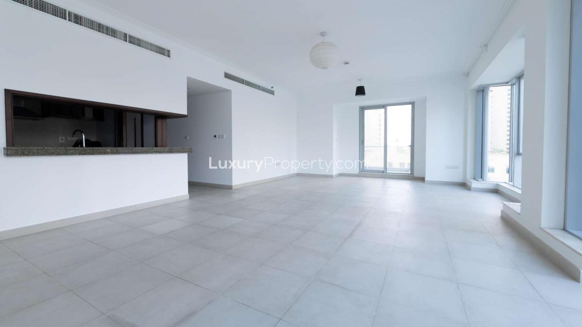 Spacious Dubai Marina apartment with large windows, street views, and modern interior design