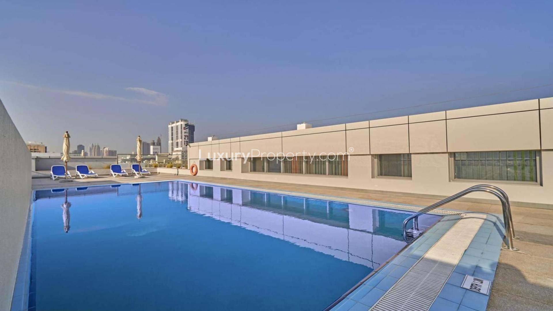 Rooftop pool view in Al Barsha apartment near Mall of the Emirates for rent