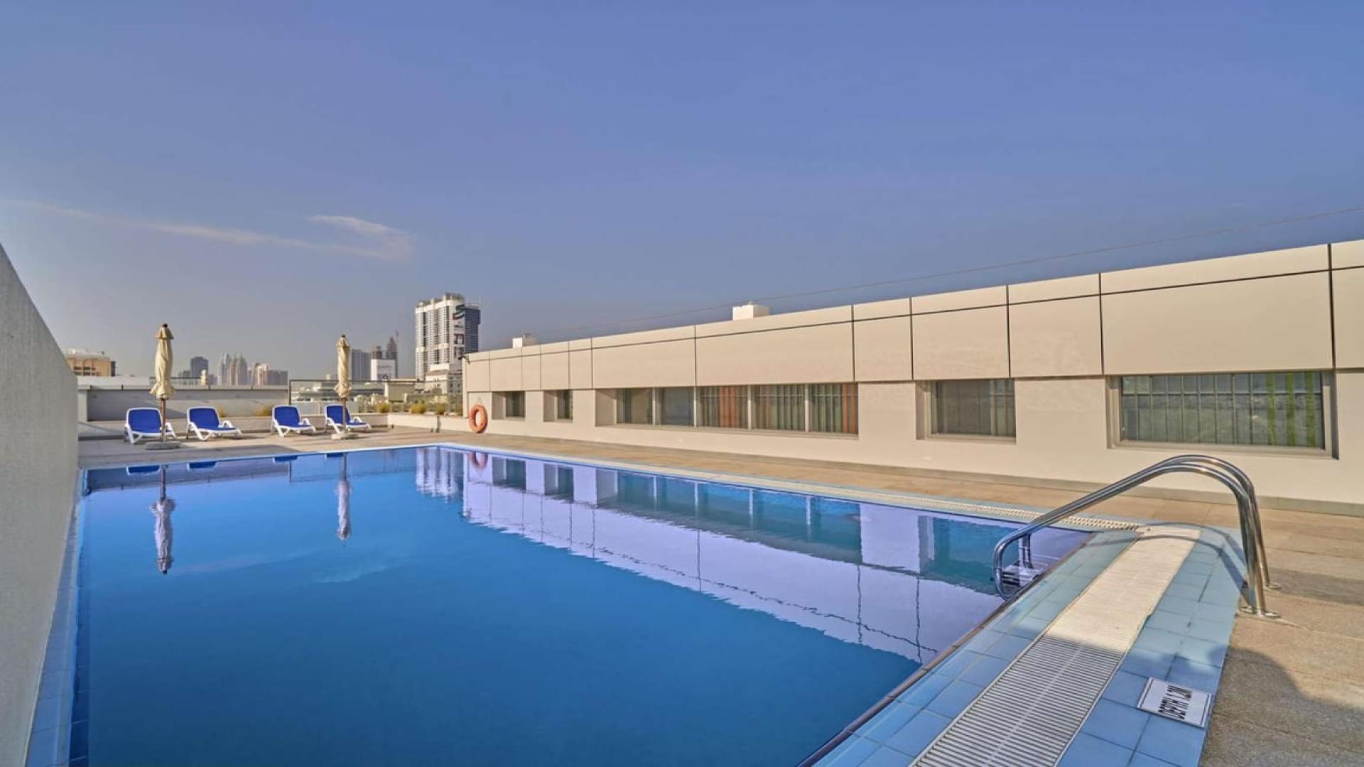 Rooftop pool view in Al Barsha apartment near Mall of the Emirates for rent