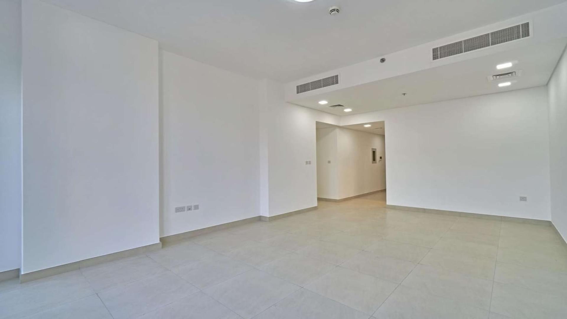 Bright living room with large windows in Al Barsha 1 apartment for rent