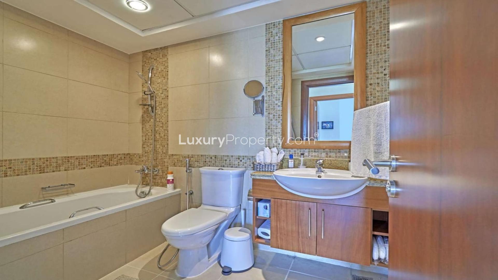 Modern living room with large windows and city view in Dubai apartment for rent