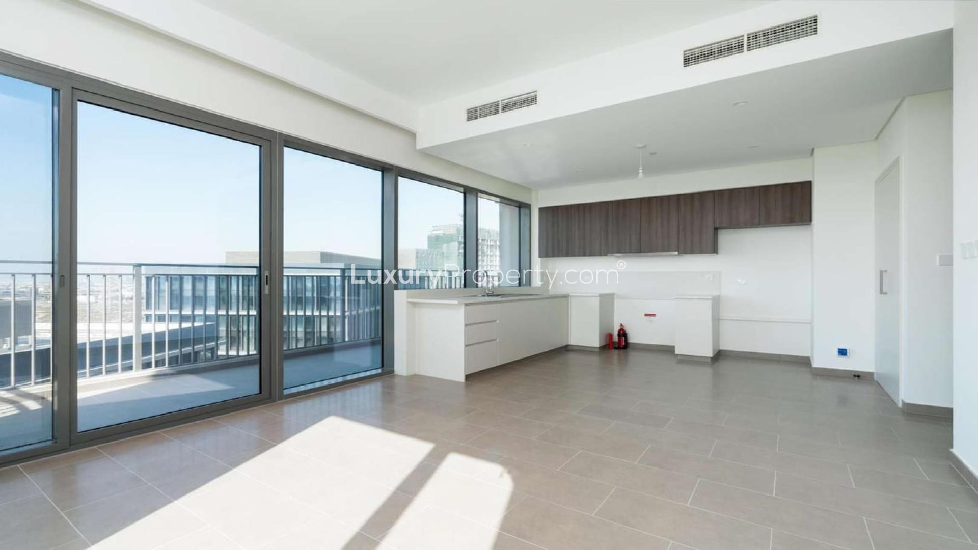 Modern kitchen with large windows in Dubai Hills Estate apartment, Park Heights