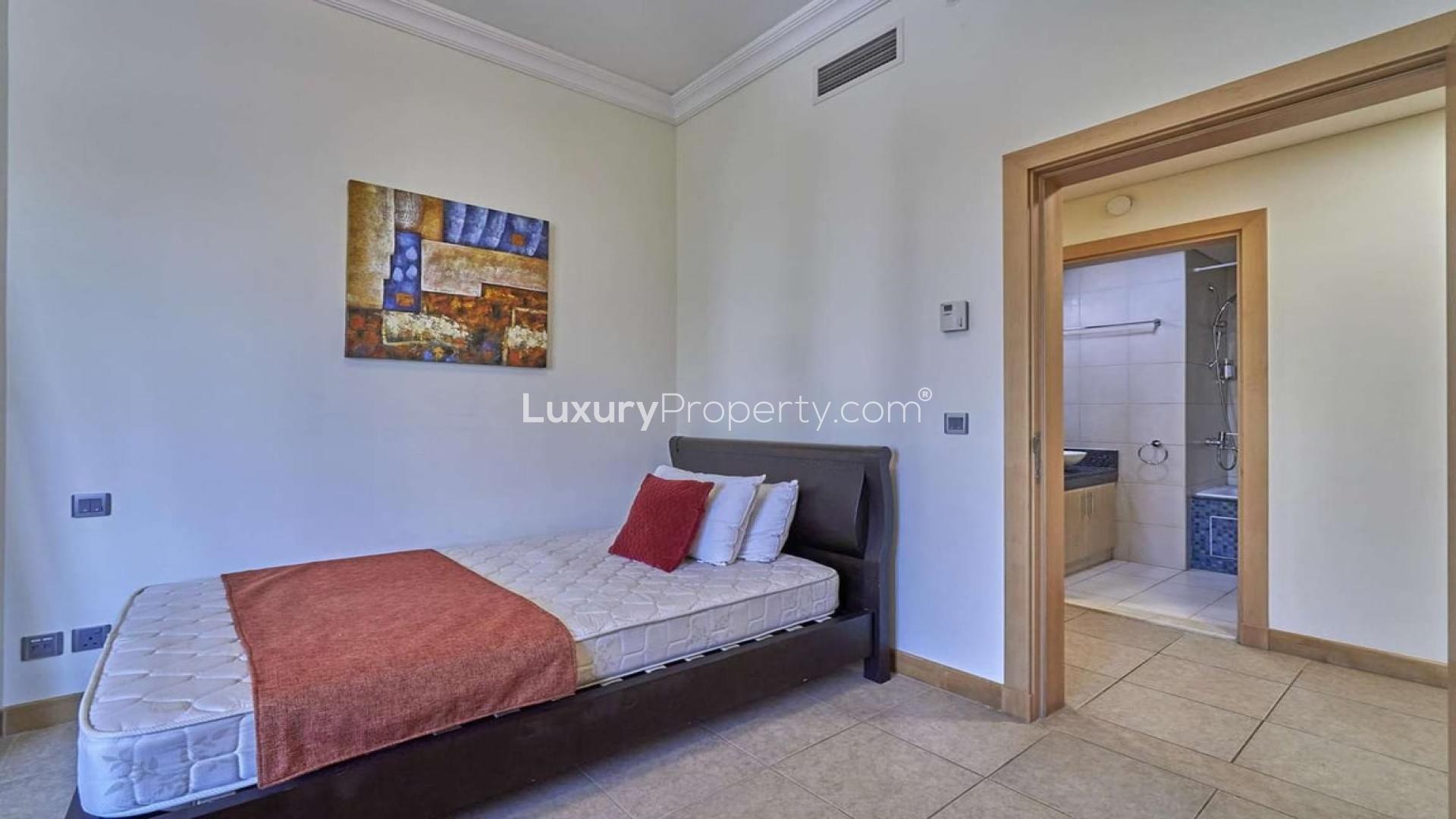 Furnished bedroom in Al Dabas apartment, Palm Jumeirah with city view window