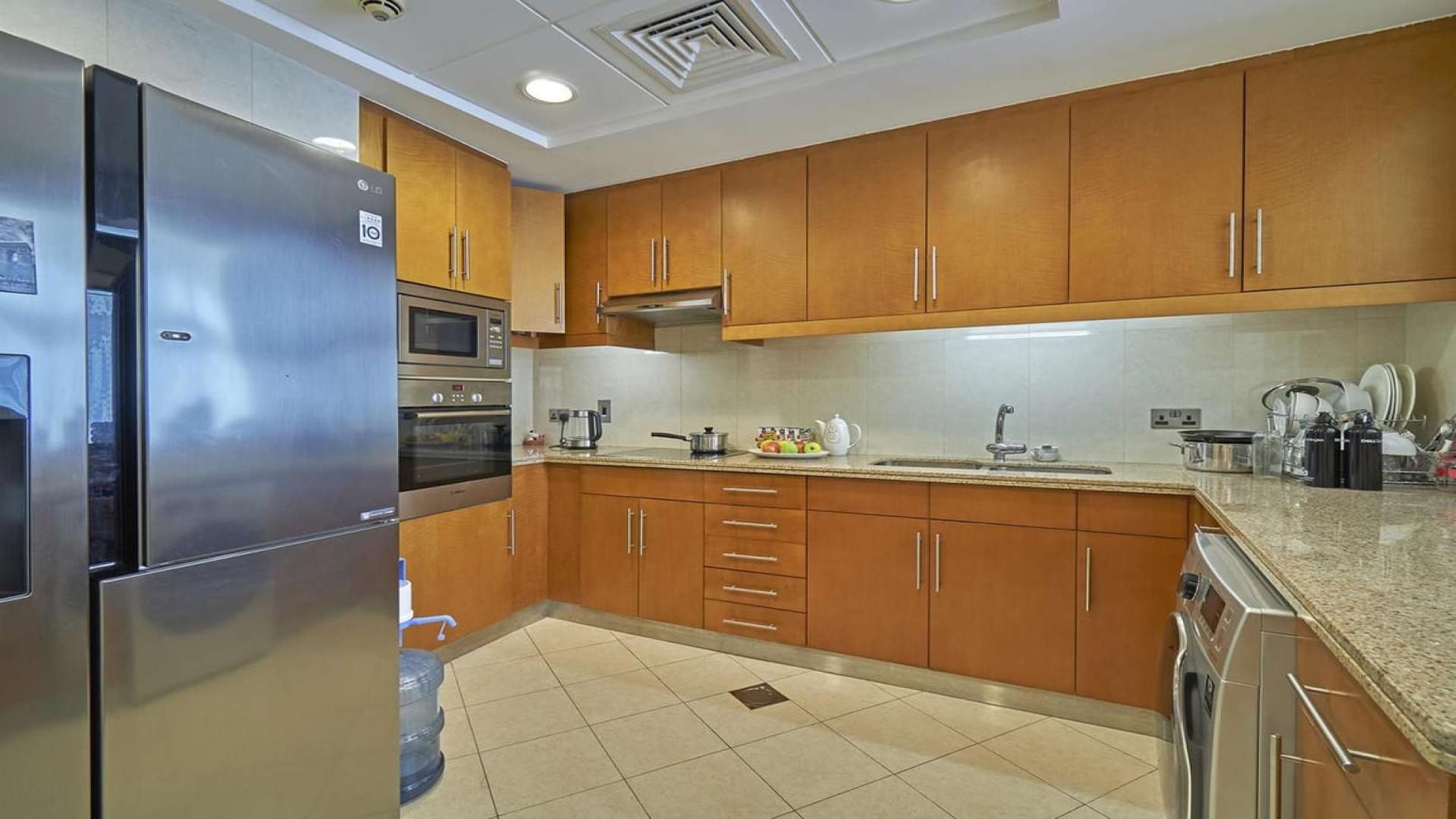 Outdoor seating area on a spacious balcony in Trident Grand, Dubai Marina apartment