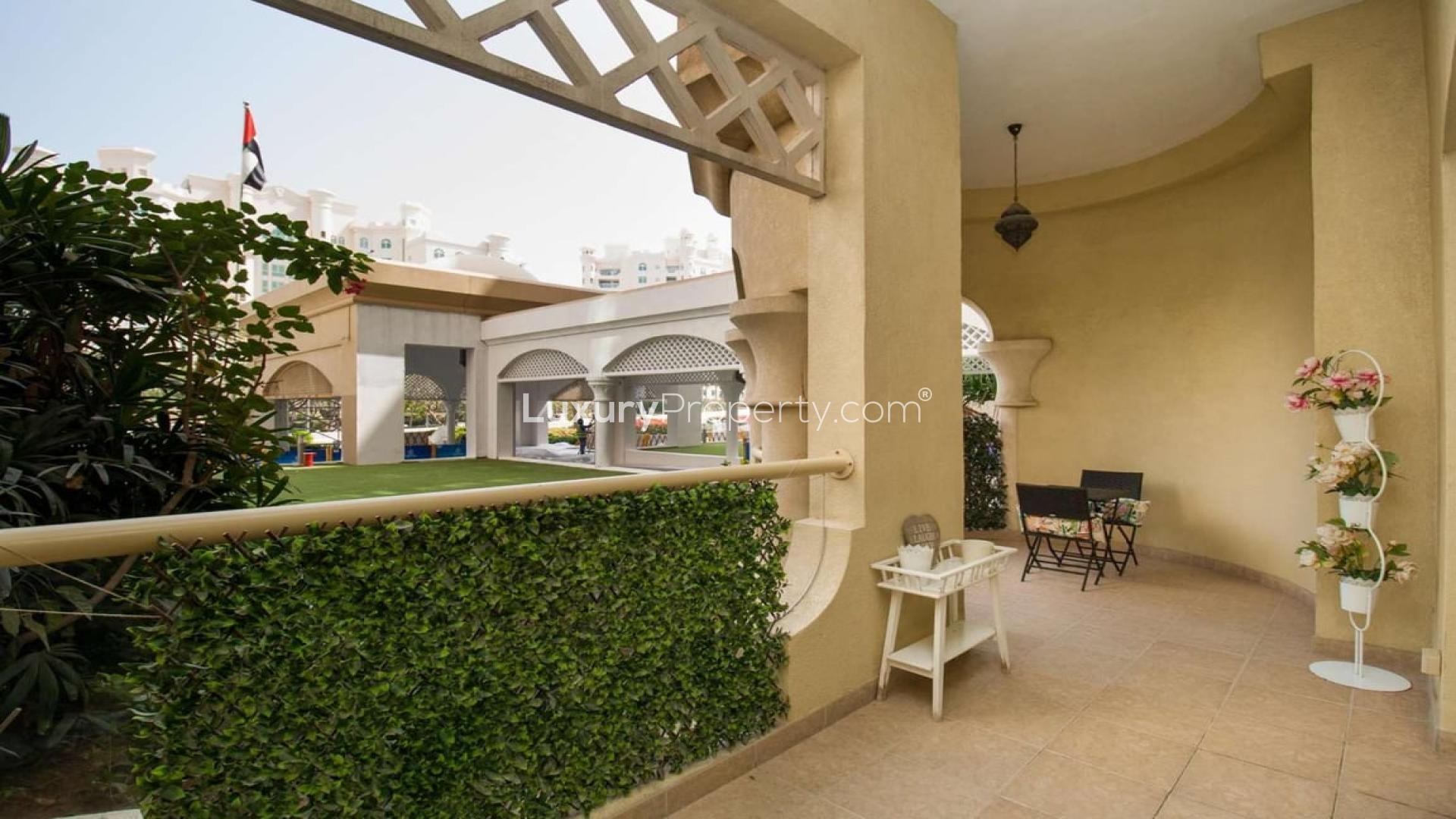 Elegant bedroom in Shoreline Apartments, Palm Jumeirah, featuring large window and modern decor