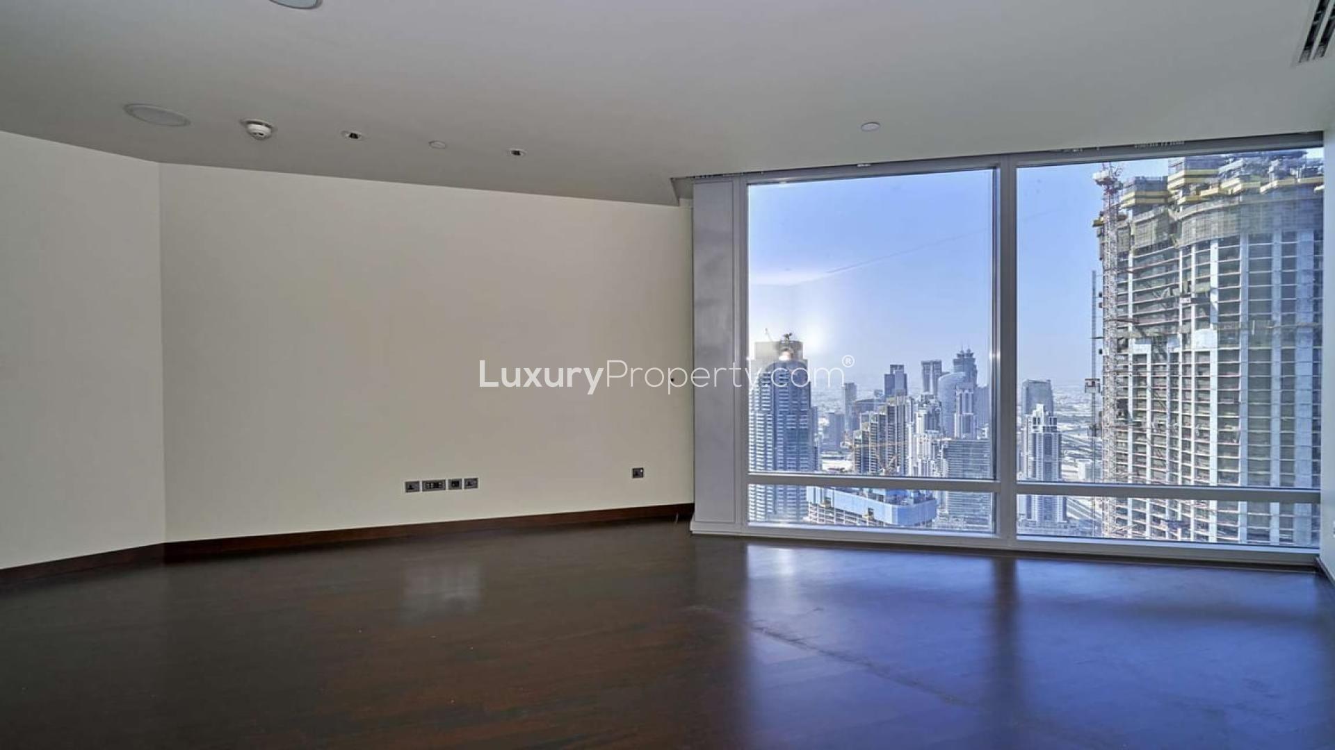 Stunning Burj Khalifa apartment interior with cityscape view, hardwood floors, spacious living area