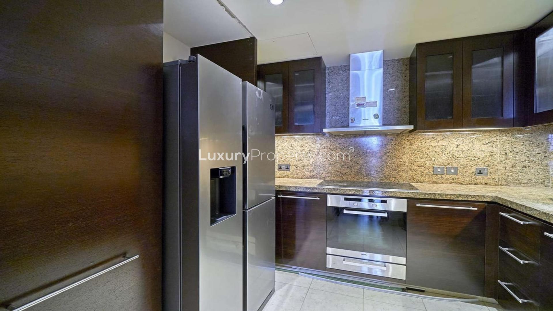 Aerial view of Downtown Dubai skyline from Burj Khalifa apartment, showcasing modern architecture