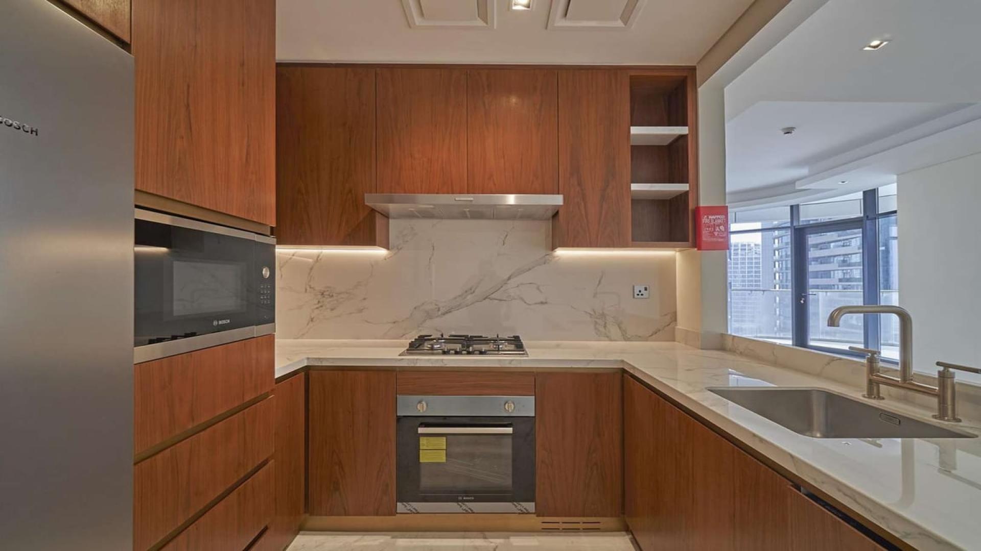 Bright living room with floor-to-ceiling windows in RP Heights, Downtown Dubai apartment