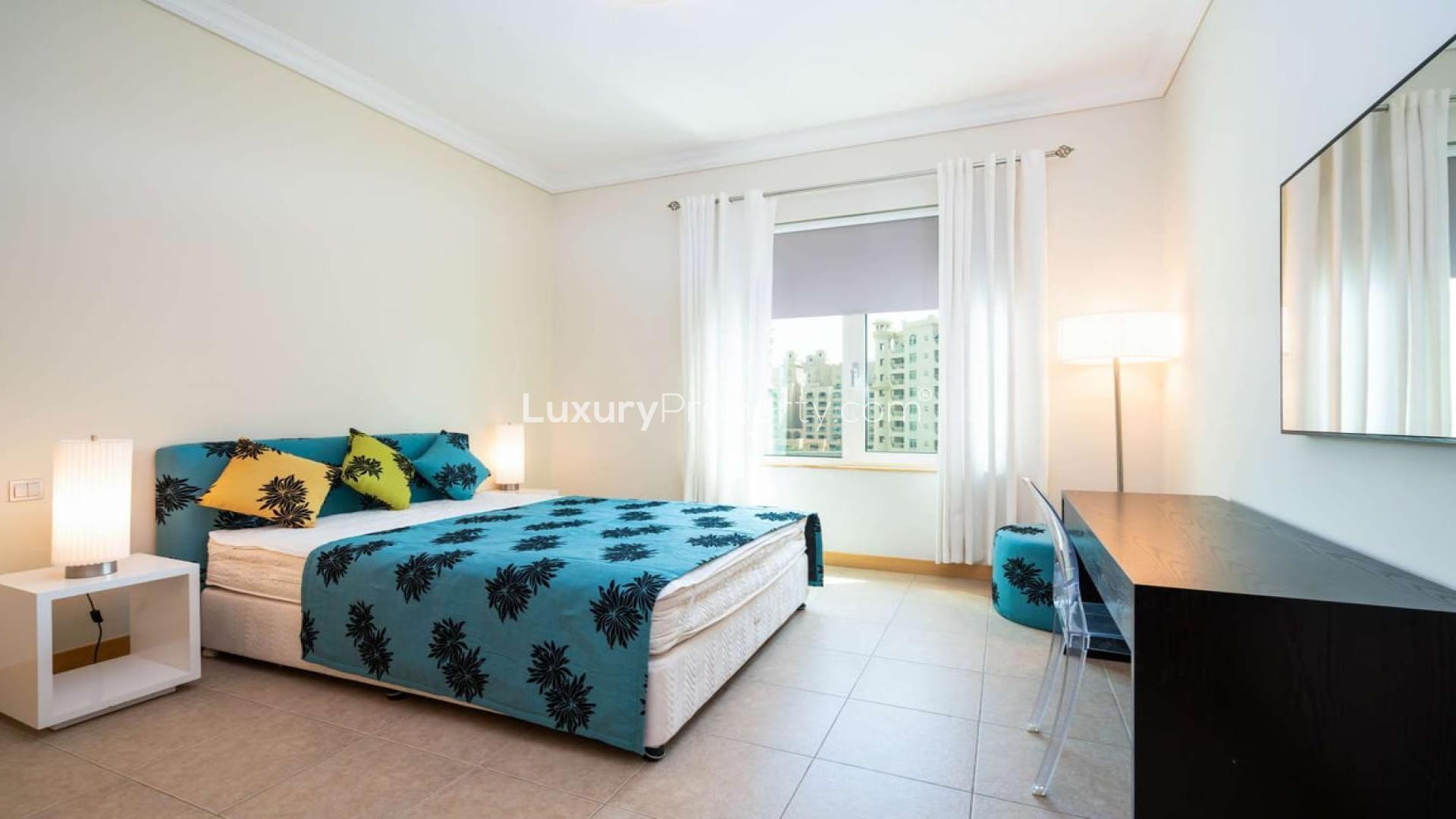 Furnished bedroom in Shoreline Residences apartment, Palm Jumeirah, with modern decor and city view