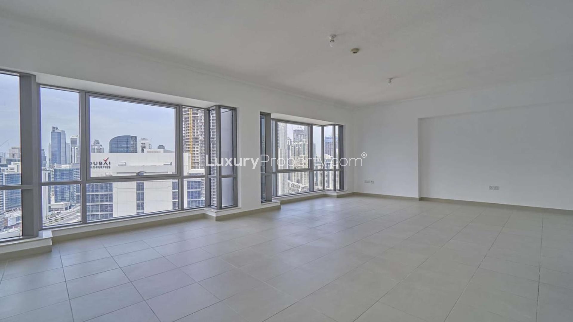 "Balcony view from 2-bedroom apartment for rent in South Ridge, Downtown Dubai.",Unfurnished spacious living room in 2-bedroom apartment, South Ridge, Downtown Dubai skyline view