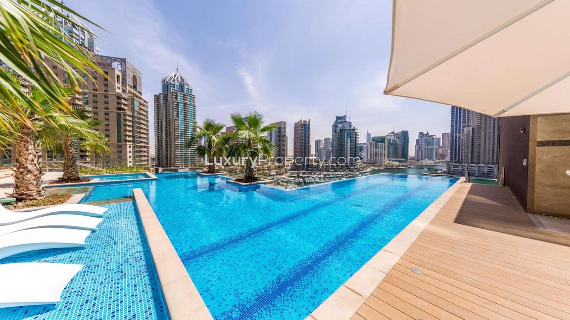 Luxurious living room in 2-bedroom Marina Gate apartment, Dubai Marina, modern decor, open kitchen