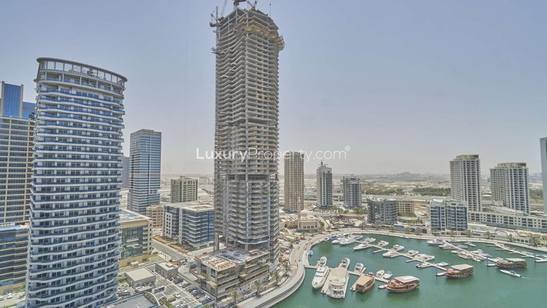 Dubai Marina skyline view from Sparkle Towers apartment for rent, featuring waterfront promenade