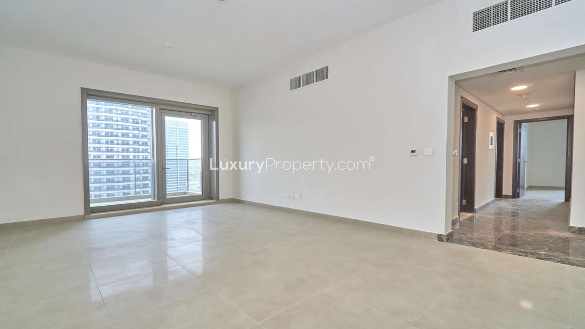Modern apartment interior with large windows offering Dubai Marina skyline view, Sparkle Towers