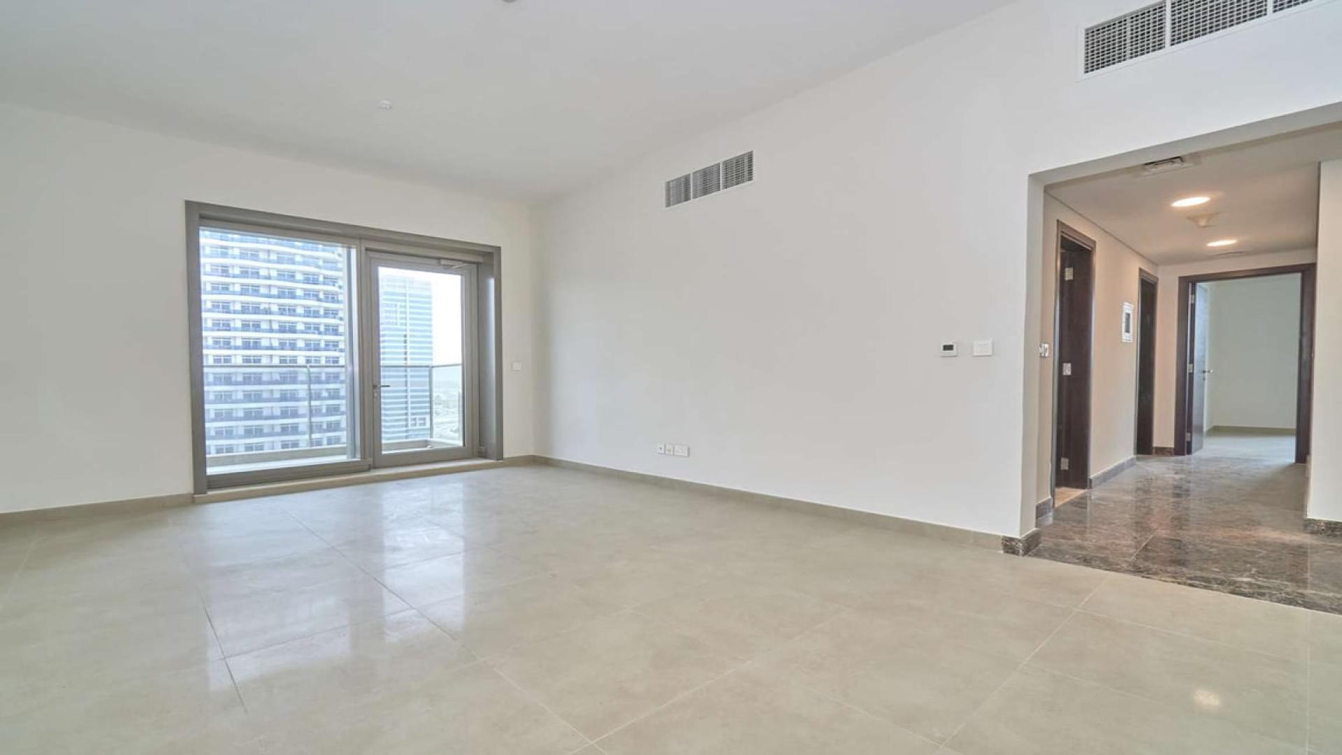 Modern apartment interior with large windows offering Dubai Marina skyline view, Sparkle Towers