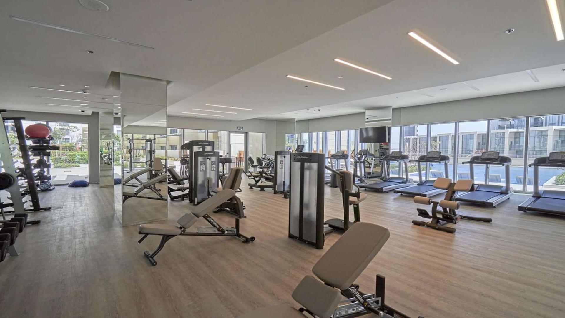 Bright, modern kitchen and living area in Dubai Creek Harbour apartment for rent