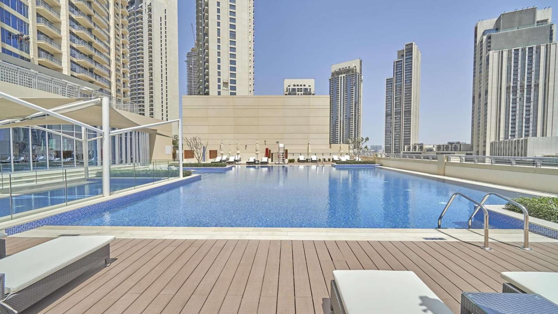 Outdoor swimming pool at Harbour Views 1, Dubai Creek Harbour apartment complex