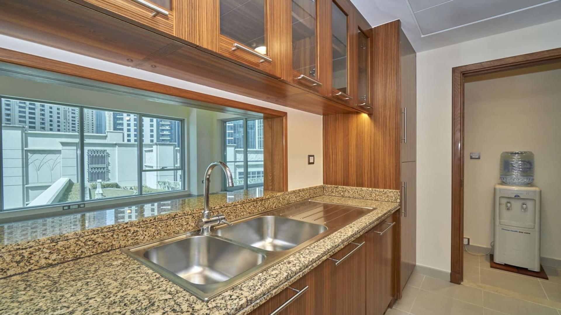 Modern kitchen with granite countertops in Marina Promenade apartment, Dubai Marina for rent