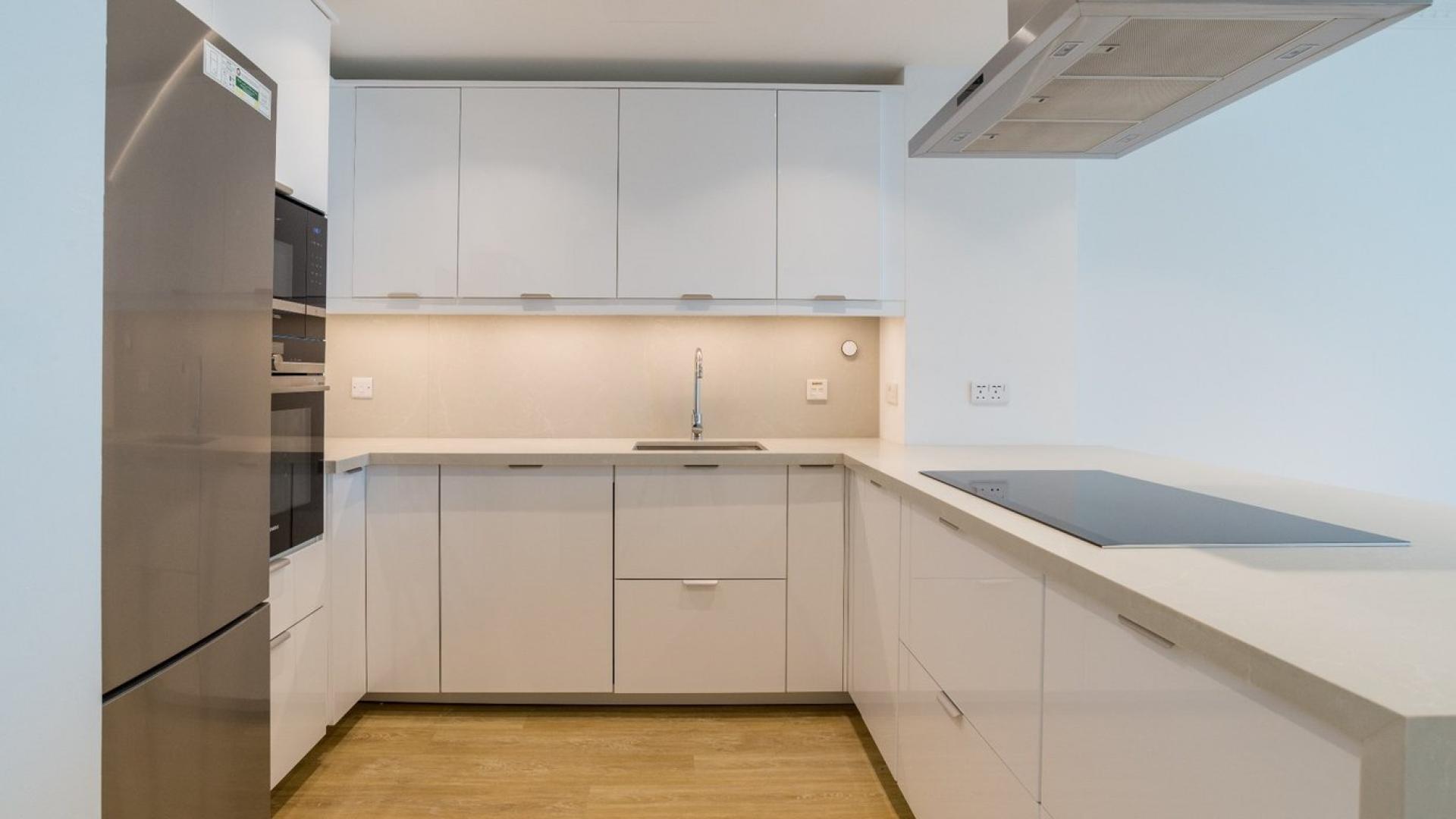 Newly renovated kitchen and living area in Al Yass Tower apartment, Dubai Marina