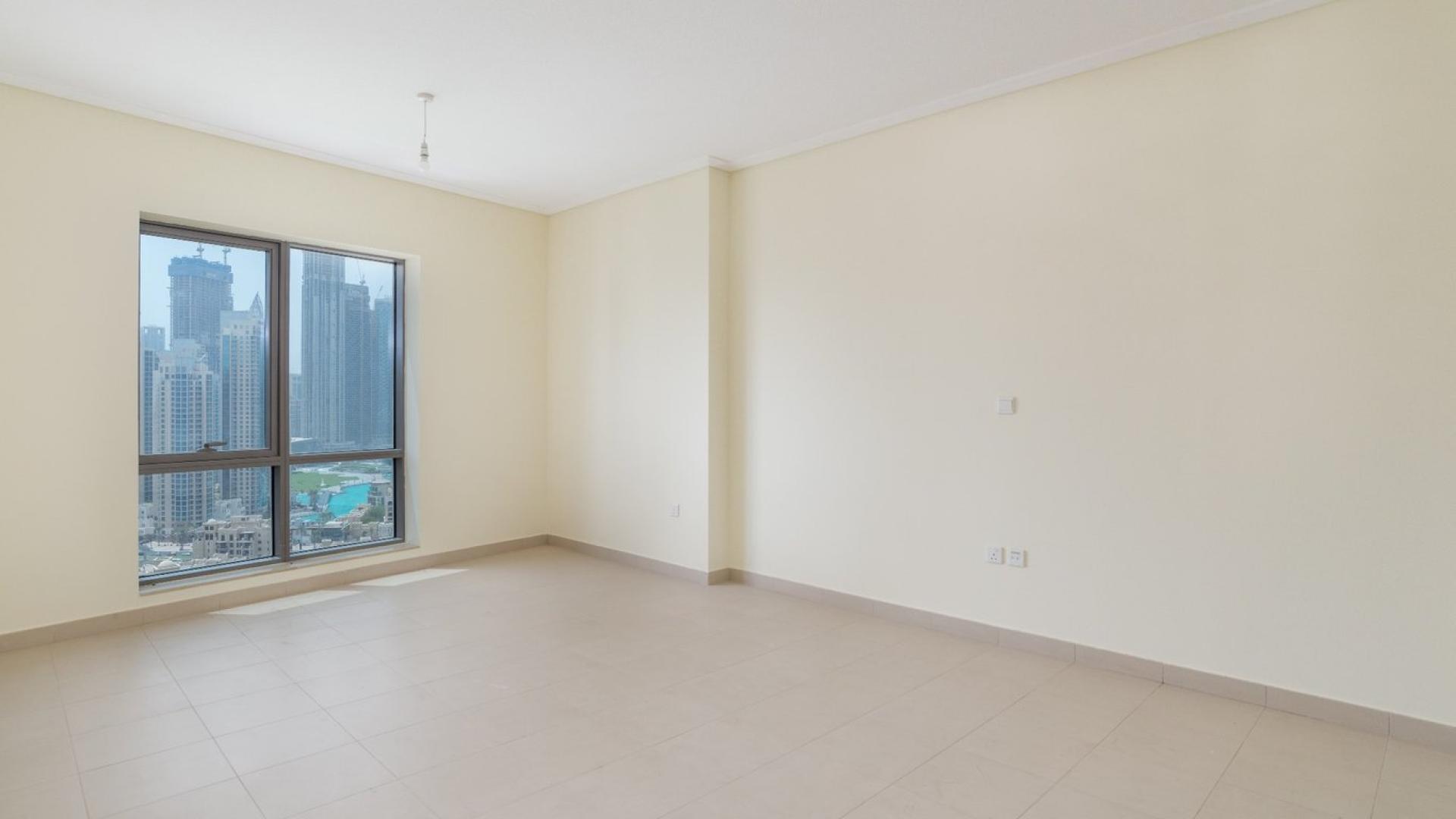 Spacious living room with large windows and city view in South Ridge, Downtown Dubai apartment