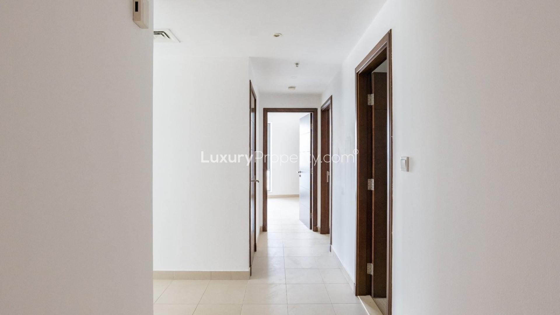 Empty living room with large windows in South Ridge Tower 6, Downtown Dubai apartment