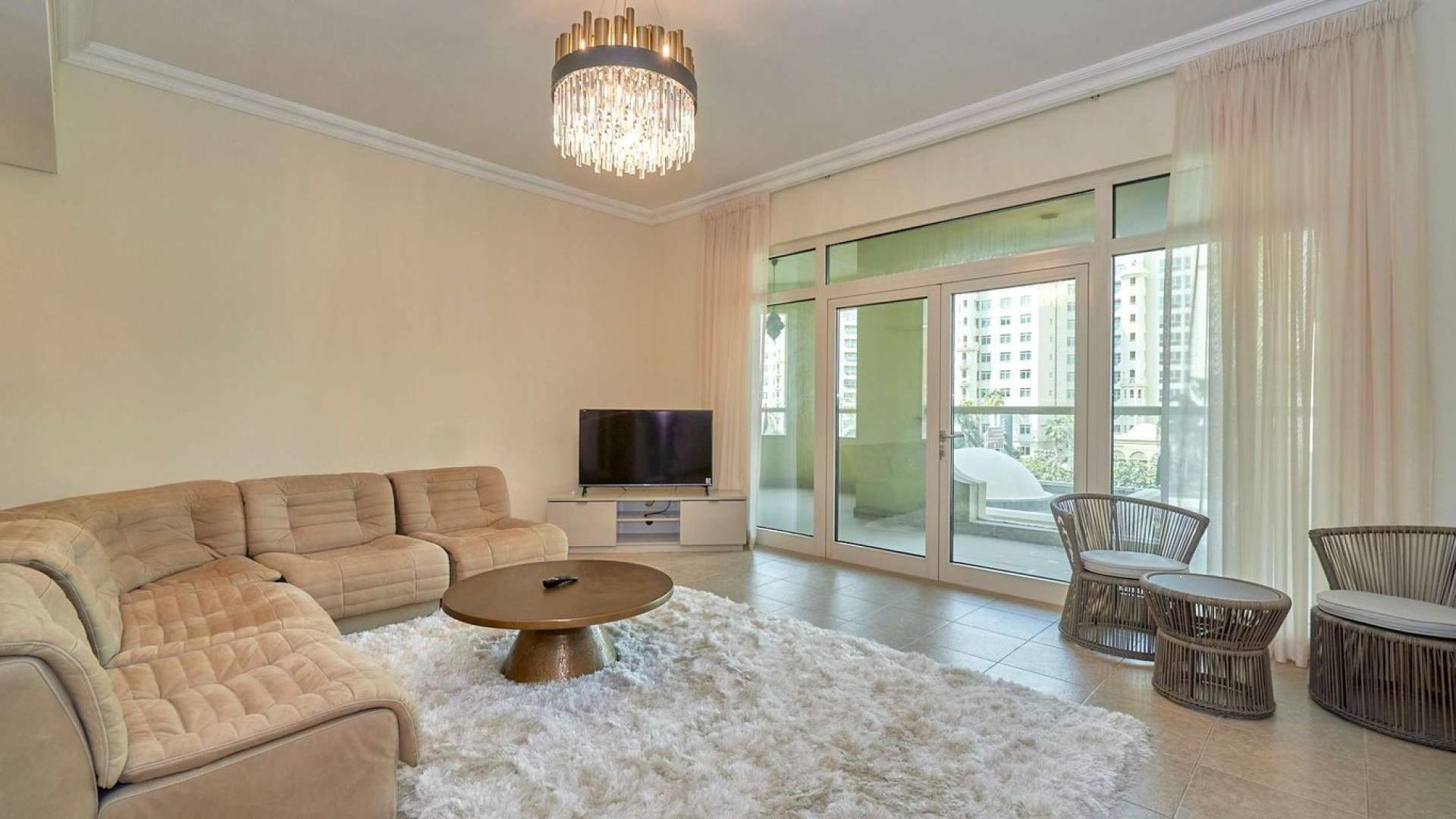 Furnished bedroom in Shoreline Apartments, Palm Jumeirah with elegant decor and ample lighting