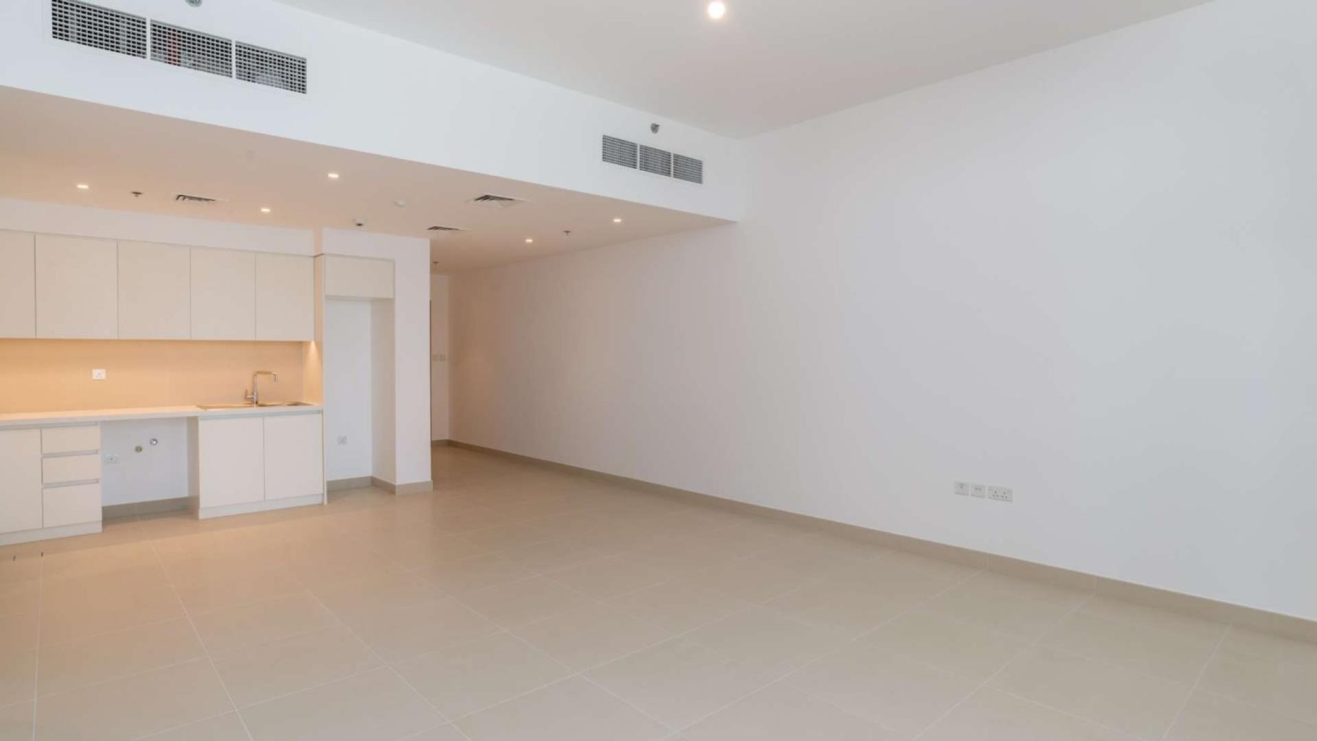 Bright living area with balcony in 2-bedroom apartment, Creek Horizon, Dubai Creek Harbour