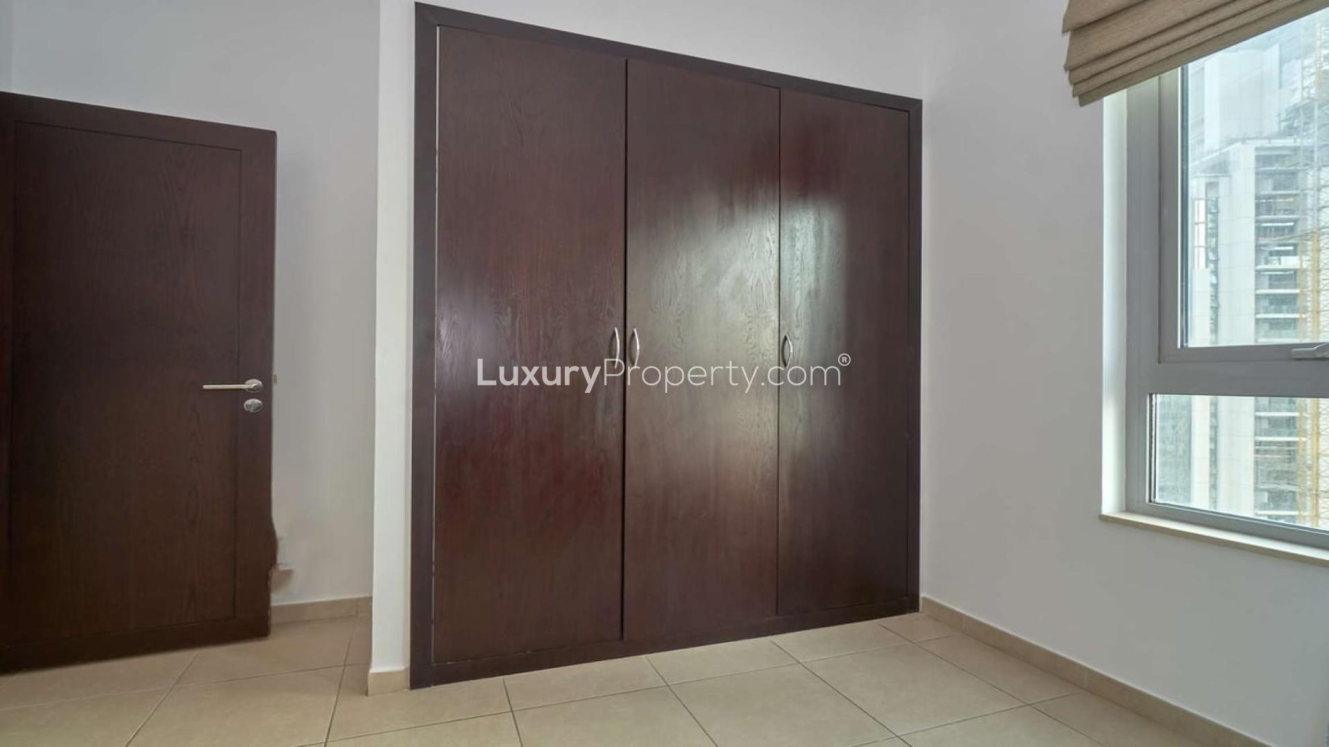 "Spacious bedroom with built-in wardrobe in 2-bedroom apartment, The Residences, Downtown Dubai.",Furnished living and dining area in 2-bedroom apartment, The Residences, Downtown Dubai