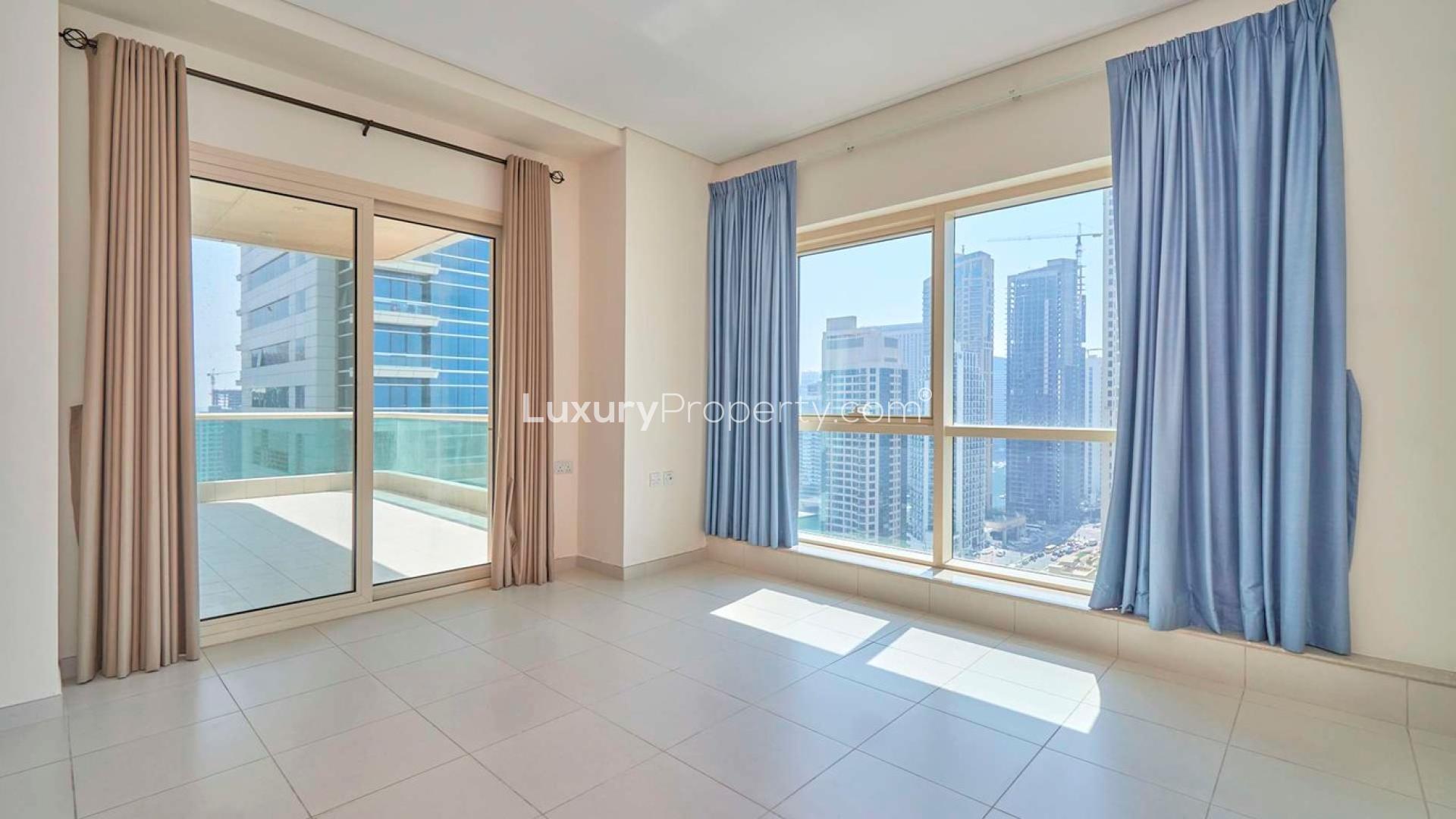 Dubai Marina skyline view from Royal Oceanic apartment, highlighting luxury residential buildings and sea