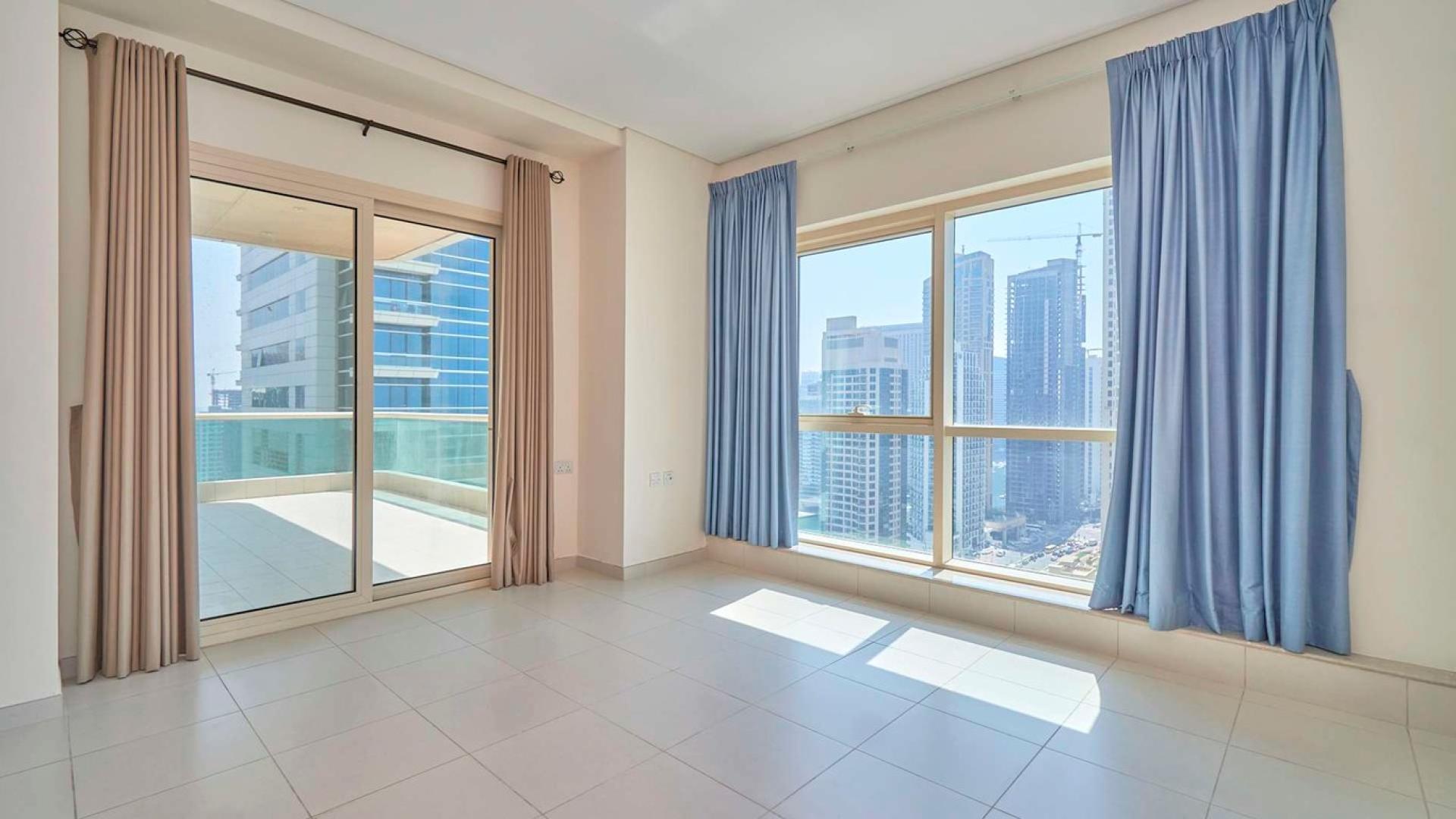 Dubai Marina skyline view from Royal Oceanic apartment, highlighting luxury residential buildings and sea