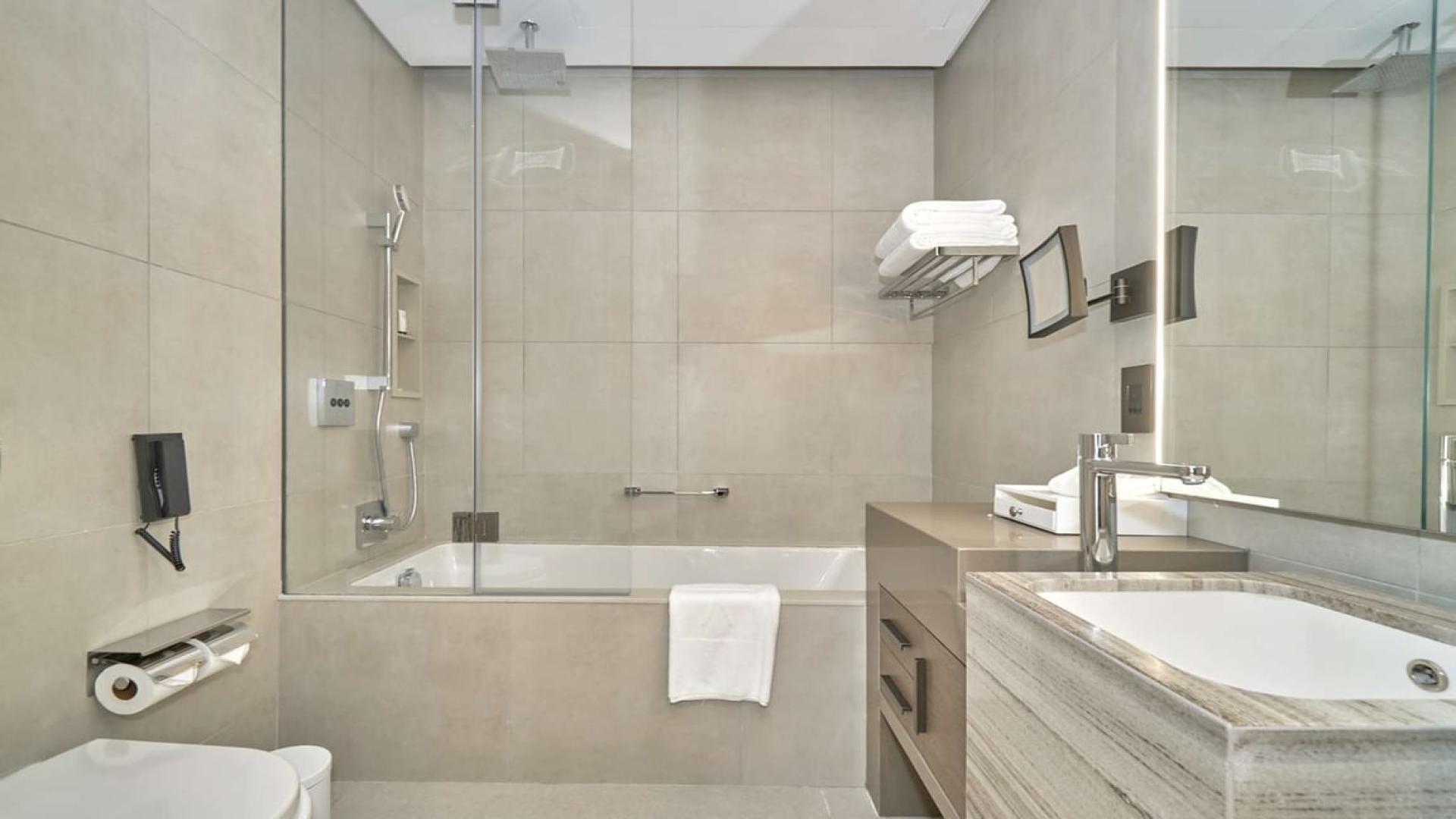 Modern living room and kitchen in 2-bedroom serviced apartment, Address JBR, sea views