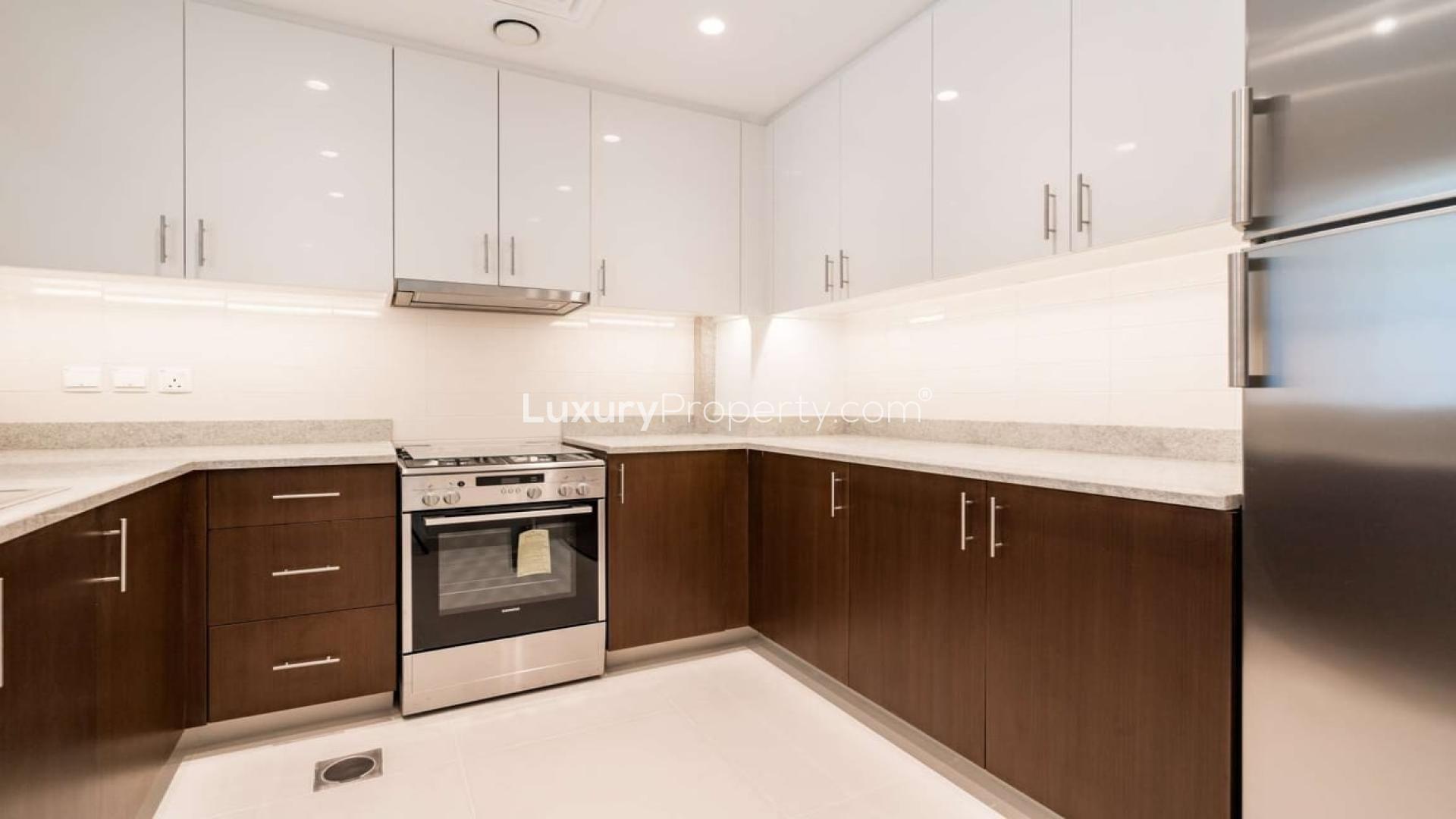 "Modern apartment pool at BLVD Crescent, Downtown Dubai, with cityscape view, for sale.",Spacious balcony with city views in Boulevard Crescent, Downtown Dubai apartment for sale