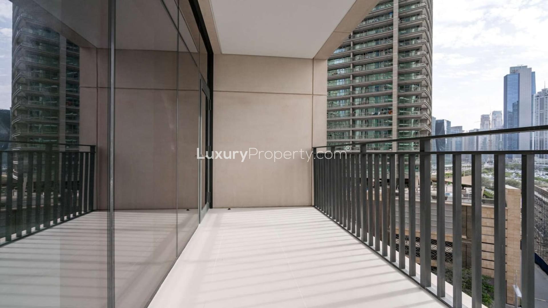 Outdoor pool area at Boulevard Crescent apartment in Downtown Dubai, available for sale