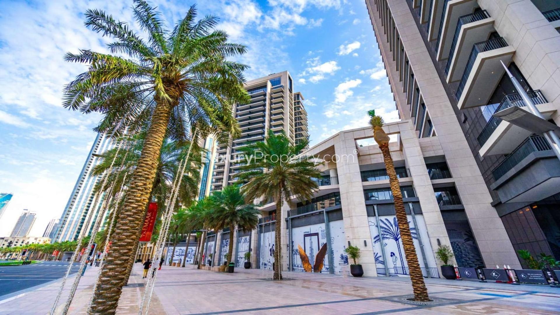 Bright living room with floor-to-ceiling windows in Boulevard Crescent apartment, Downtown Dubai