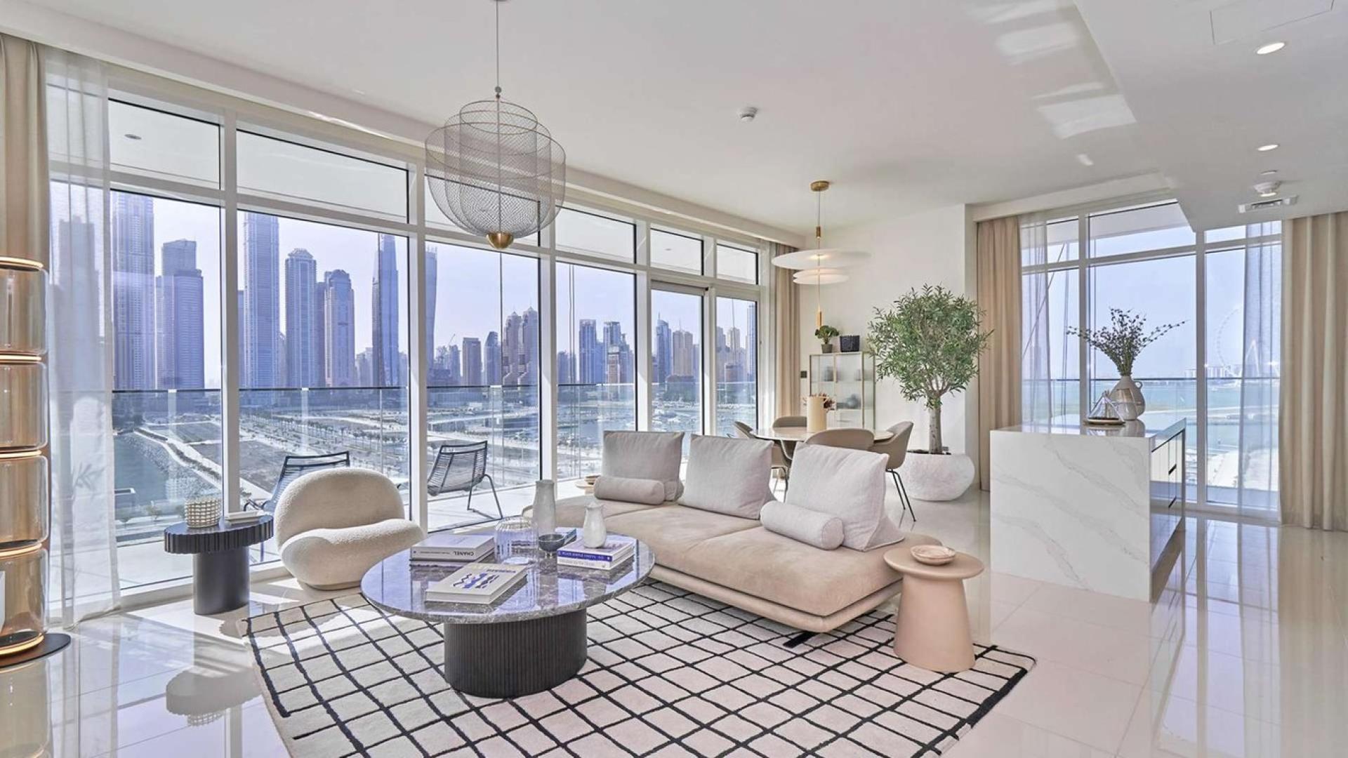 Luxurious living room with stunning skyline views, Sunrise Bay apartment, Emaar Beachfront, Dubai Harbour