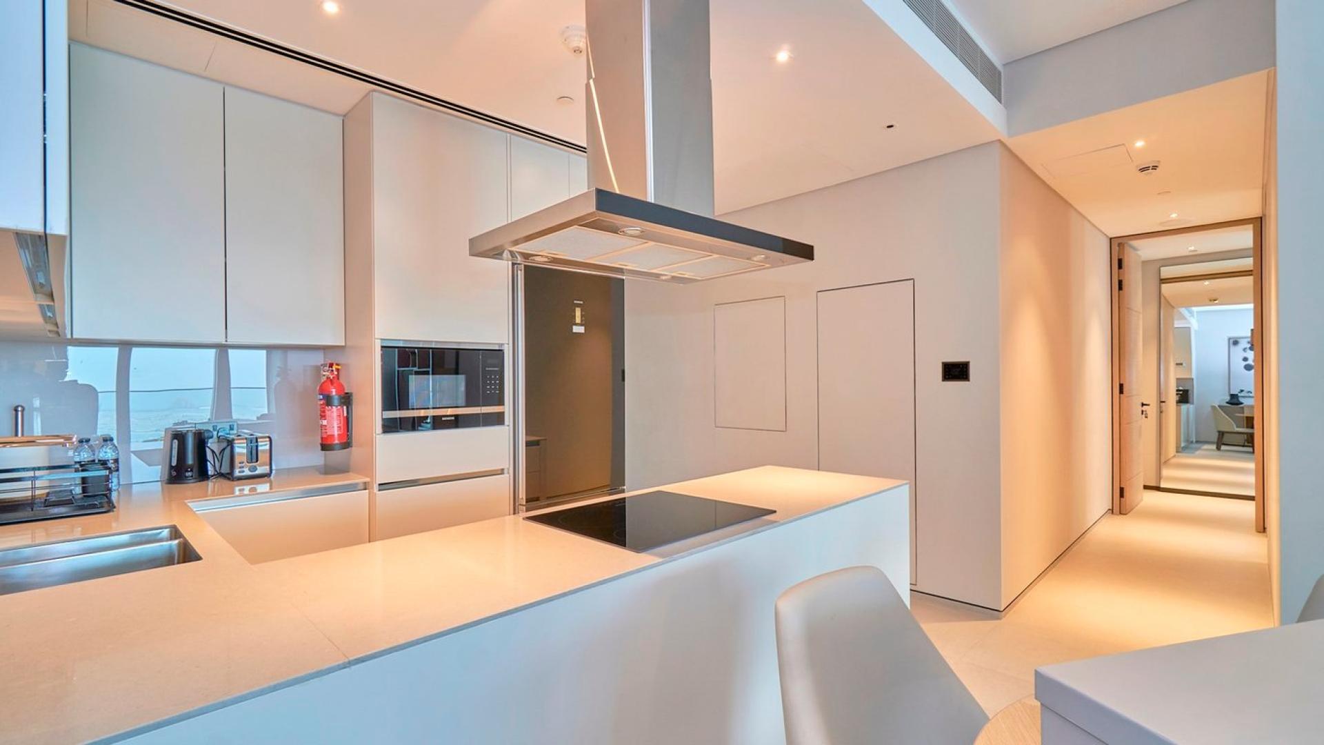 Modern living room and kitchen in 2-bedroom apartment, The Address Jumeirah Beach Resort