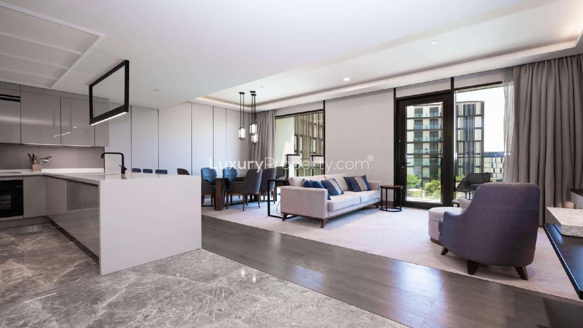 Modern living room and kitchen in 2-bedroom apartment, Caesars Bluewaters Dubai