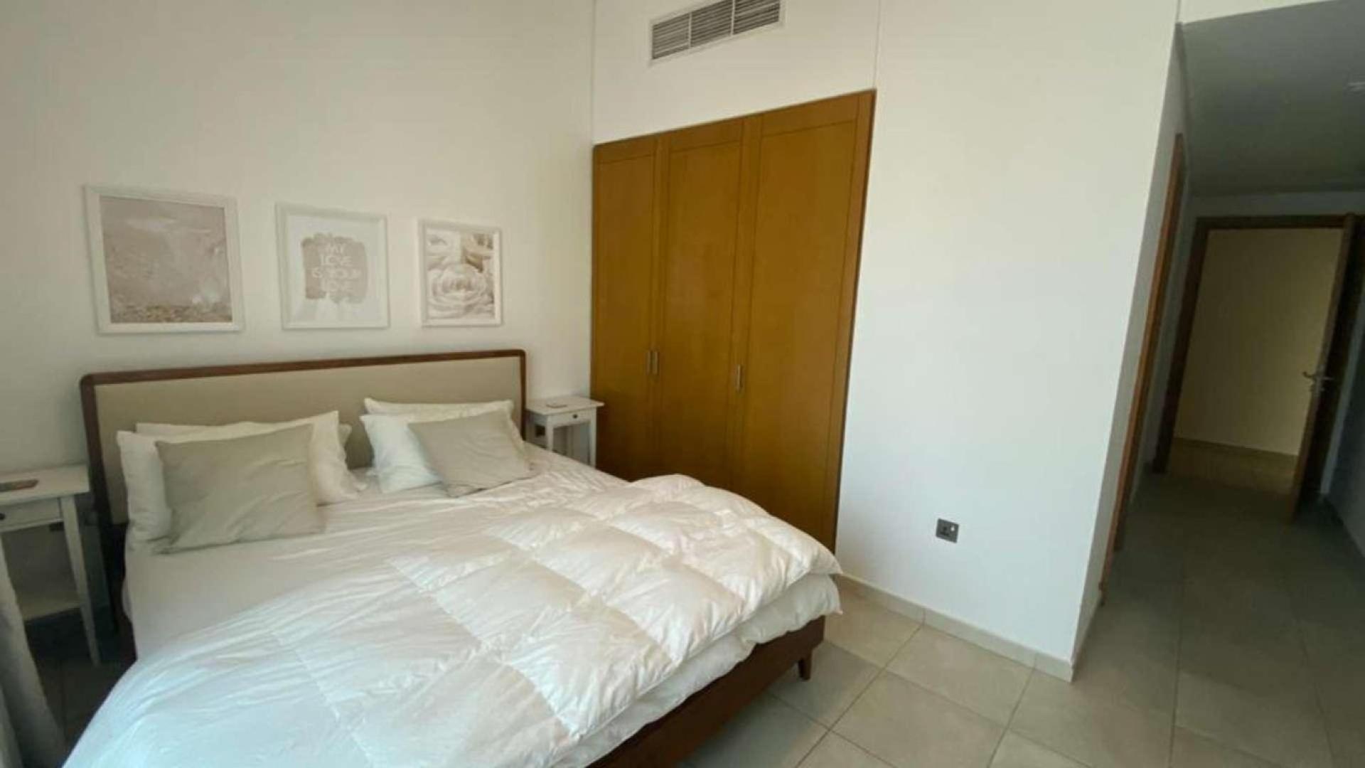 Outdoor patio of Type D apartment in Marina Residences, Palm Jumeirah, with garden furniture